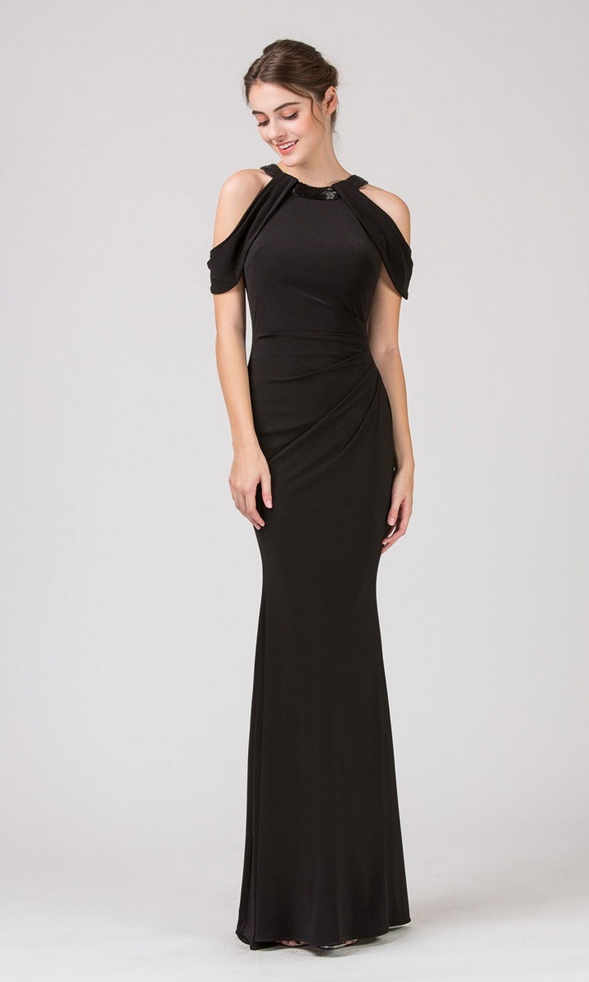 A woman models the Eureka 7400 long formal dress in black, featuring a cold shoulder neckline and fitted silhouette, against a plain light background.